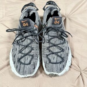 Nike unisex , women’s size 7.5 Gray Knit Athletic Shoes with Orange Logo Accent